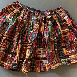 Brand new without tags flowy skirt w/book pattern